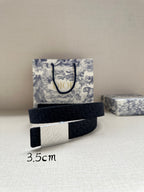 Navy leather belt with rectangular silver buckle, adjustable holes on strap.