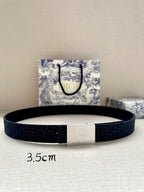 Navy leather belt with rectangular silver logo buckle, single-prong closure.