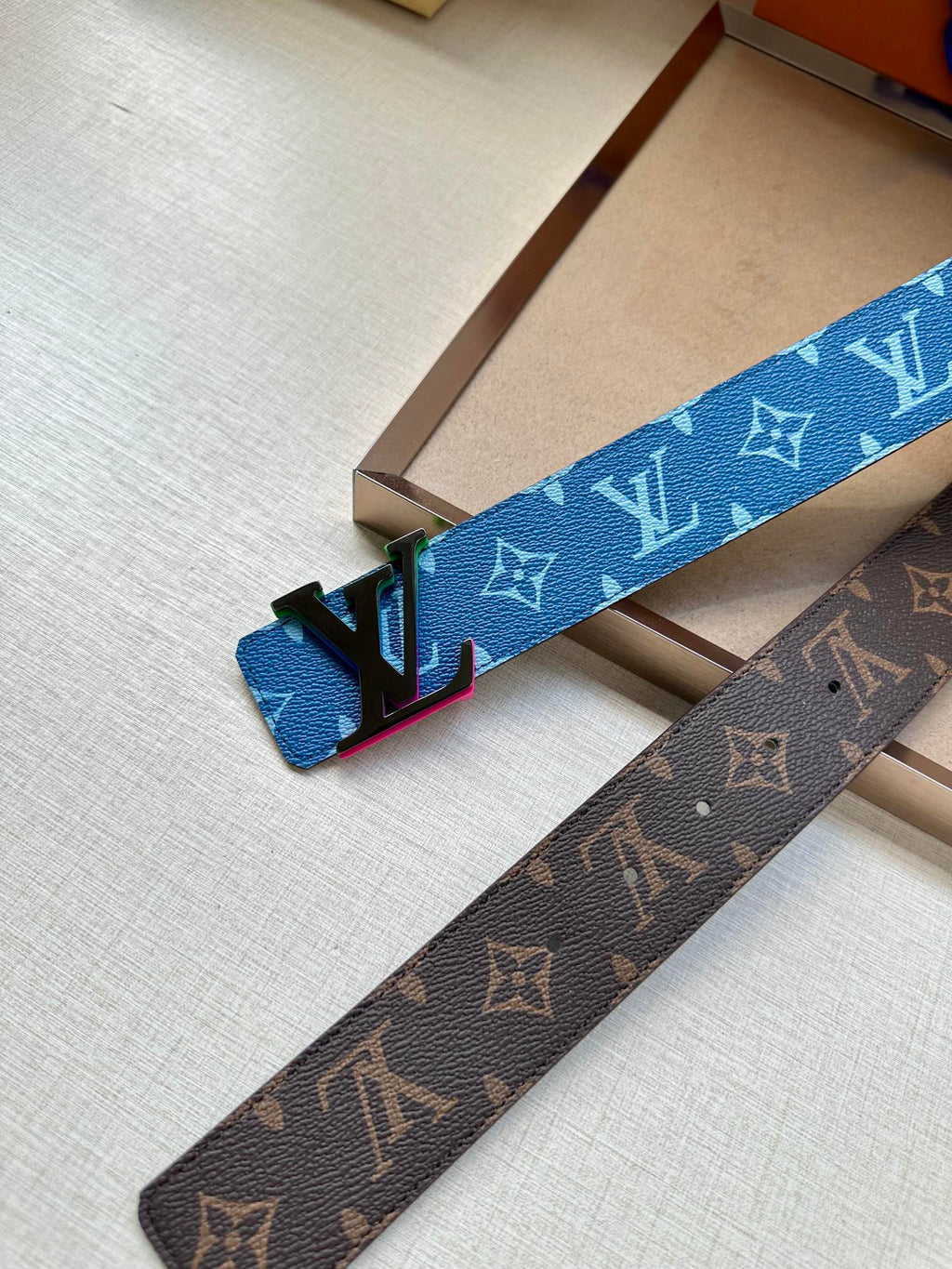 Louis Vuitton blue and brown monogram belts with metal buckles