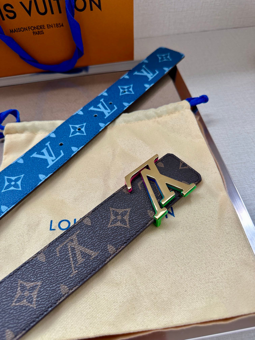 Louis Vuitton belt with blue monogram strap and LV multicolor buckle