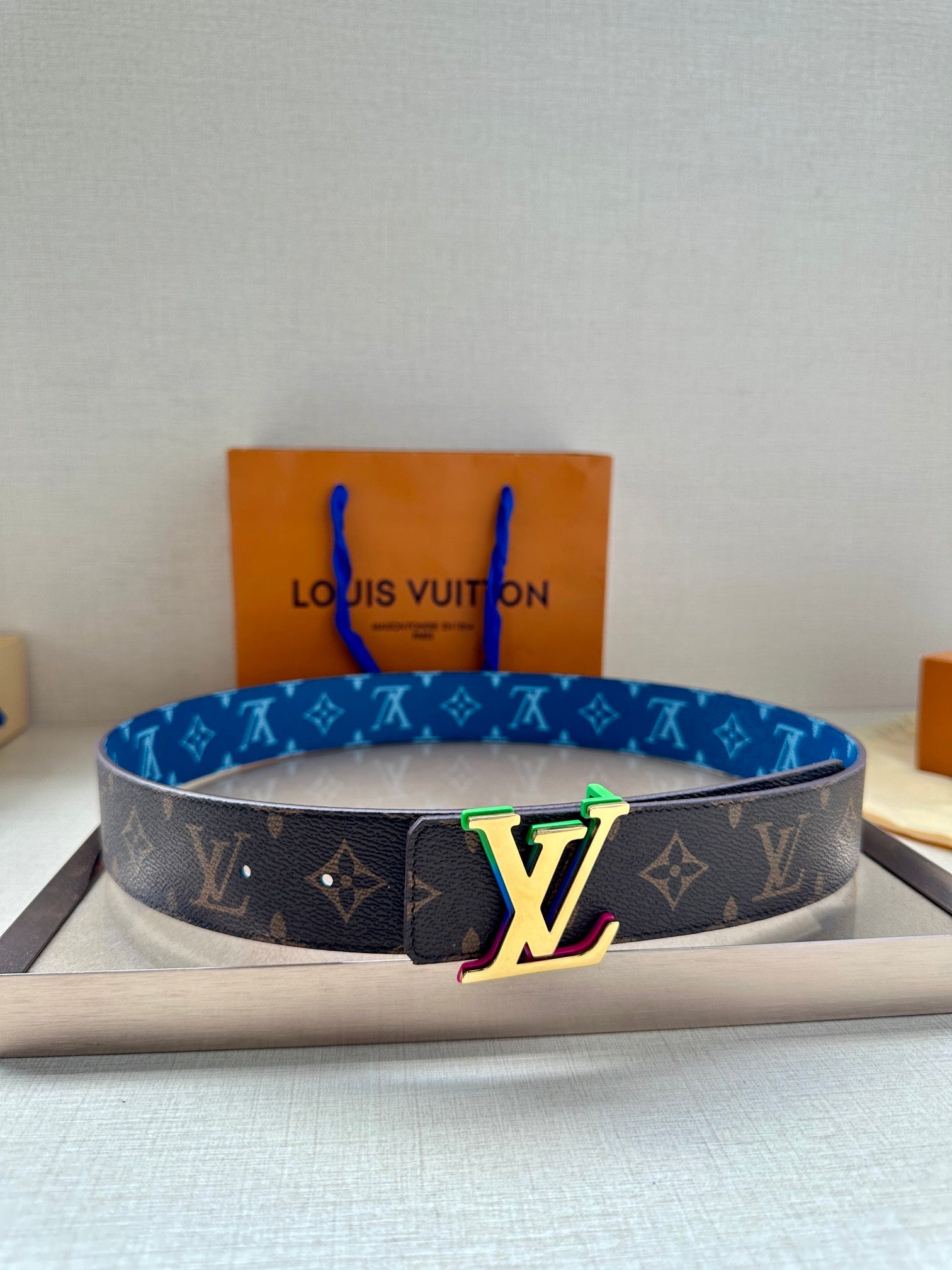 Louis Vuitton monogram belt with blue strap and LV multicolor buckle