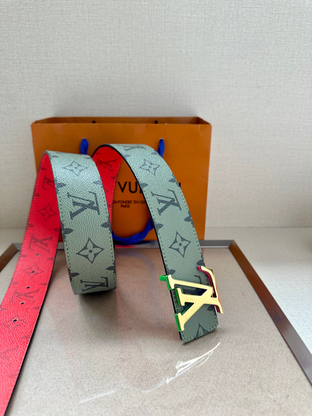 Louis Vuitton belt set with light green monogram strap and red backing strap