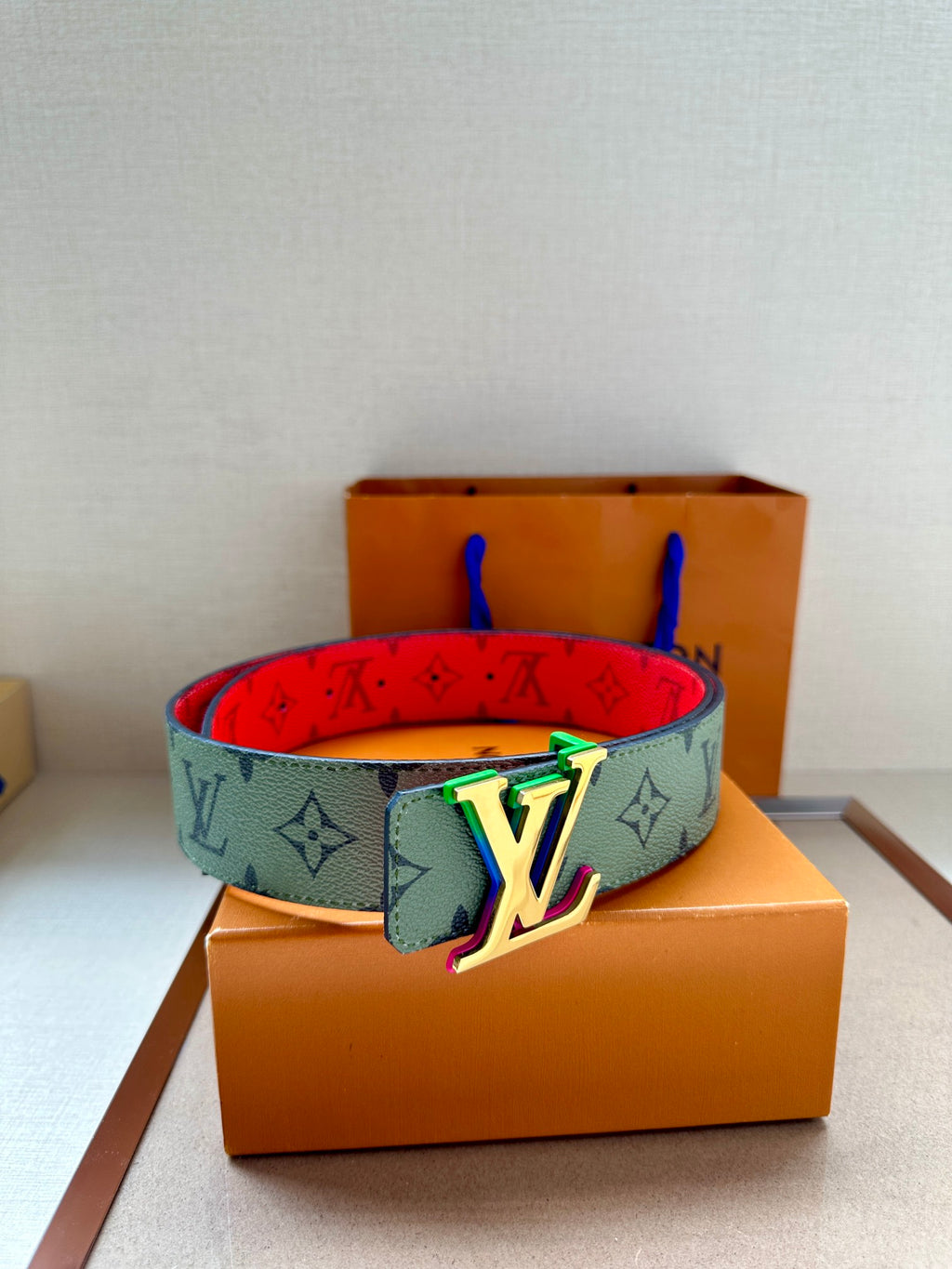 Louis Vuitton monogram belt with multicolor LV buckle on light green strap