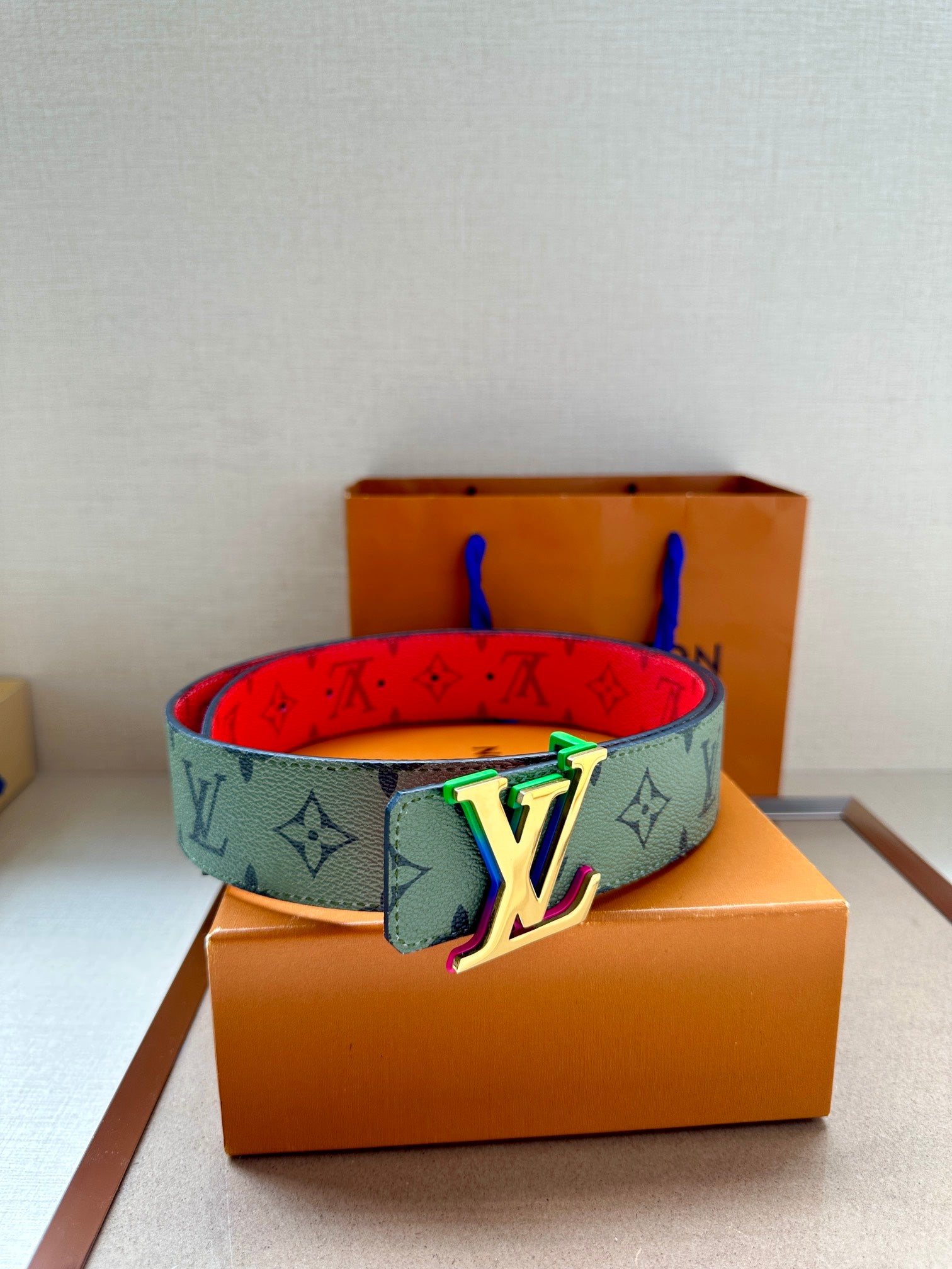 Louis Vuitton monogram belt with multicolor LV buckle on light green strap