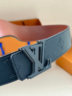 Louis Vuitton belt close-up: dark blue textured leather and silver-tone LV buckle
