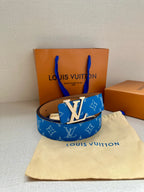 Blue monogram belt with silver-toned LV buckle and tan edge