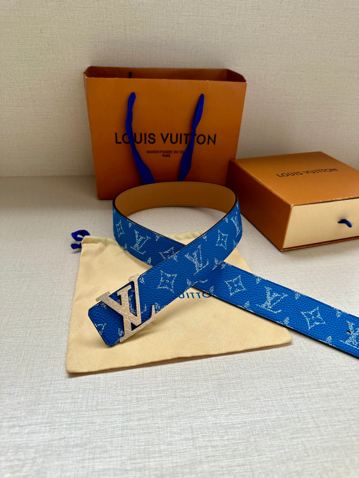 Blue monogram belt with LV buckle and loose strap end