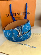 Blue monogram belt with metal buckle on tan leather backing