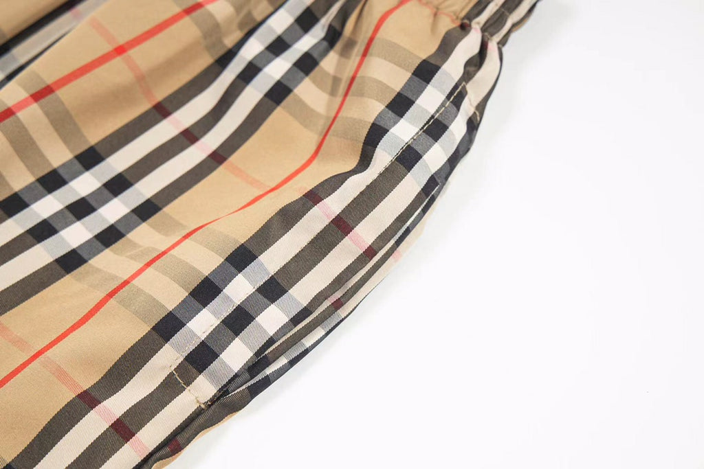 Burberry plaid shorts side seam and drawstring hem close-up