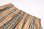 Burberry plaid shorts waistband close-up with elastic and drawstring cords