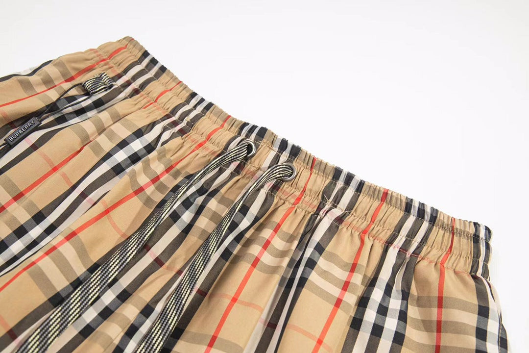 Burberry plaid shorts waistband close-up with elastic and drawstring cords