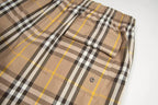 Plaid shorts with side flap pocket and snap button, beige black and yellow lines