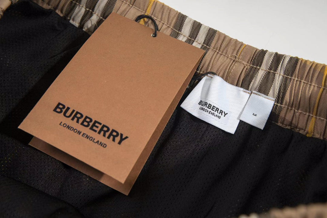 Plaid shorts with Burberry hang tag and size label, elastic waistband