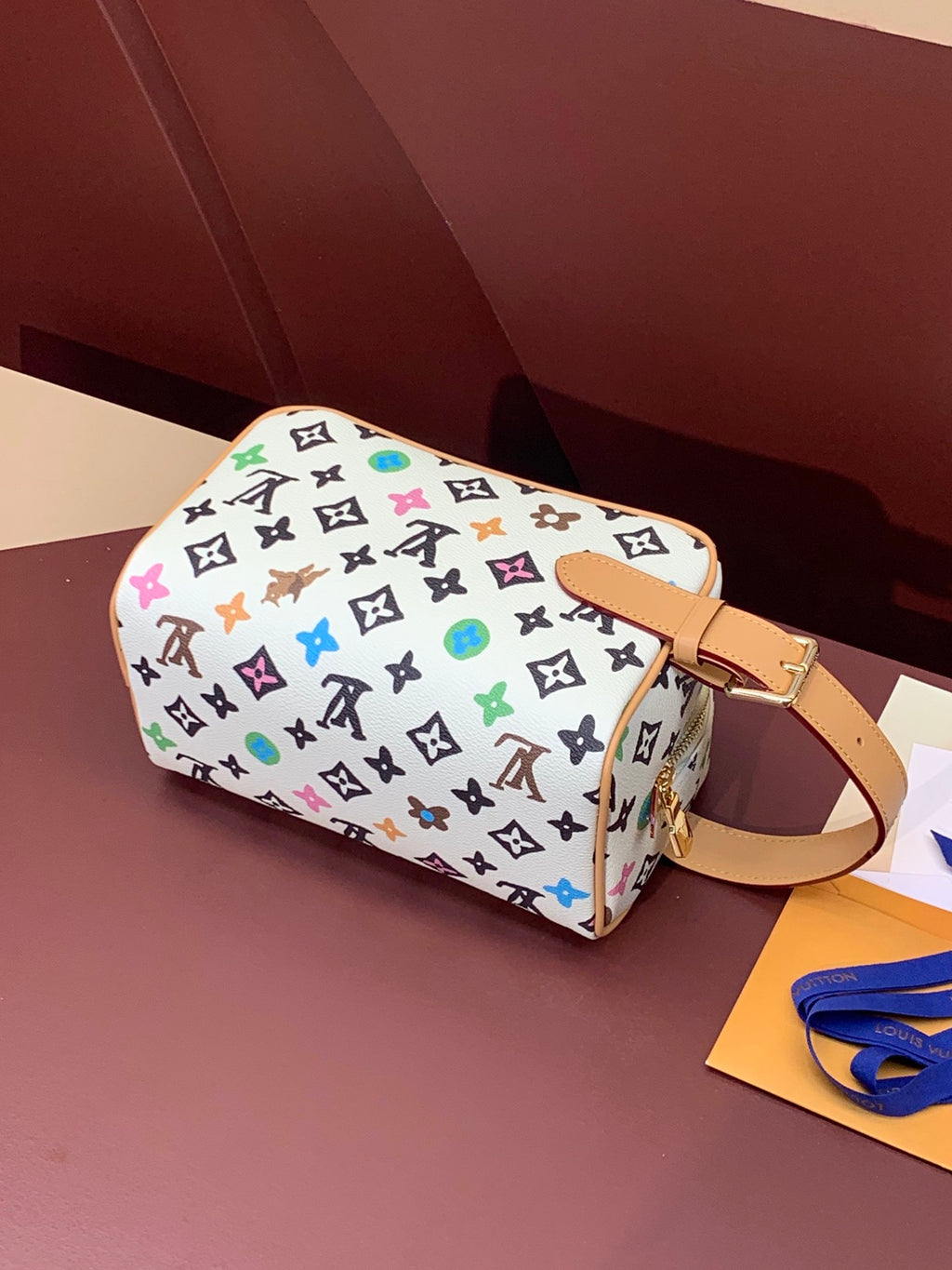 Louis Vuitton crossbody bag, multicolor monogram print, tan top handle and shoulder strap