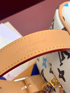 Louis Vuitton leather trim with embossed logo, tan edge stitching, gold zipper hardware