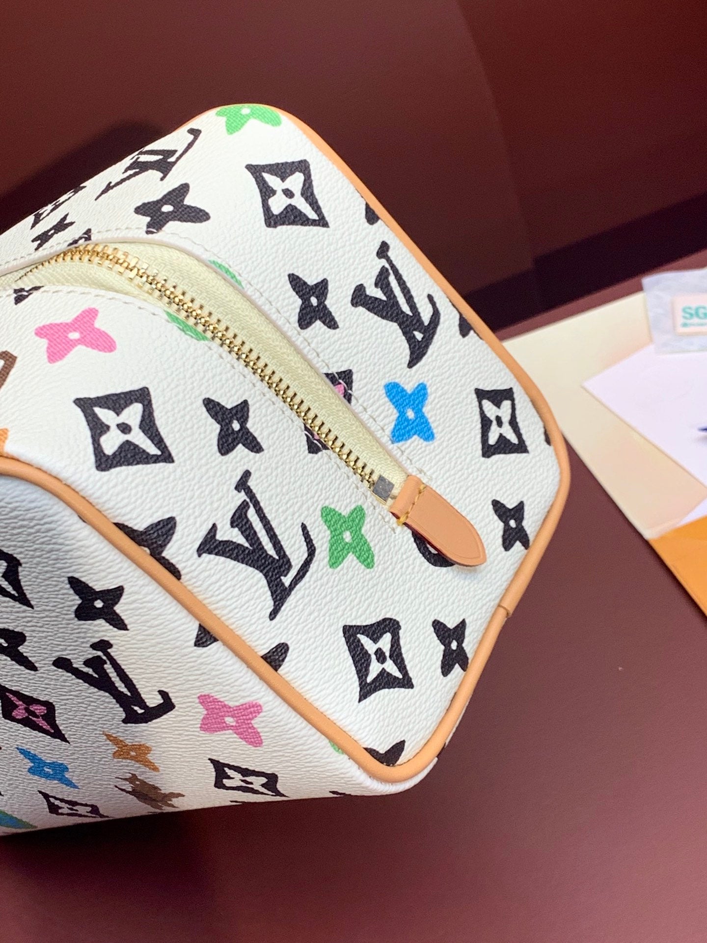 Louis Vuitton zip-top bag with multicolor monogram canvas, tan trim, gold zipper pull