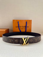 Louis Vuitton monogram belt with gold-tone LV buckle on dark strap
