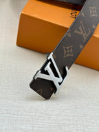 Monogram belt with large LV buckle and dark strap with metal keeper