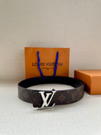 Louis Vuitton monogram belt with LV buckle and center crossbar, dark strap