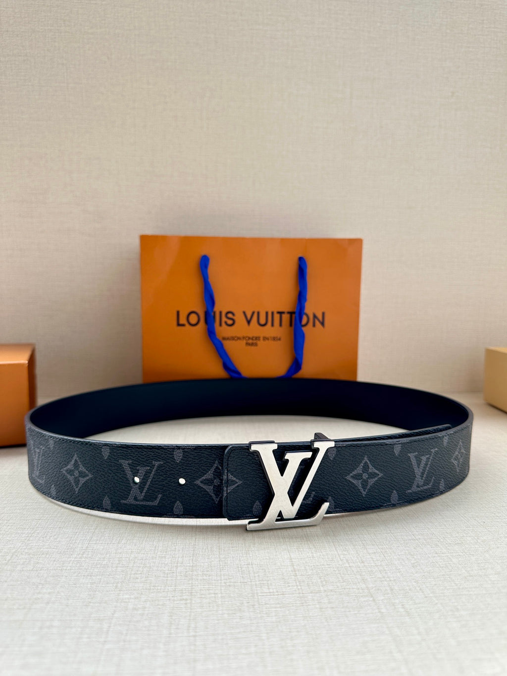 Navy monogram belt with silver-tone LV buckle