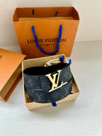 Navy monogram belt with large LV buckle, presented in a box