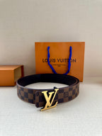 Louis Vuitton damier belt with gold-tone LV buckle, dark interior visible