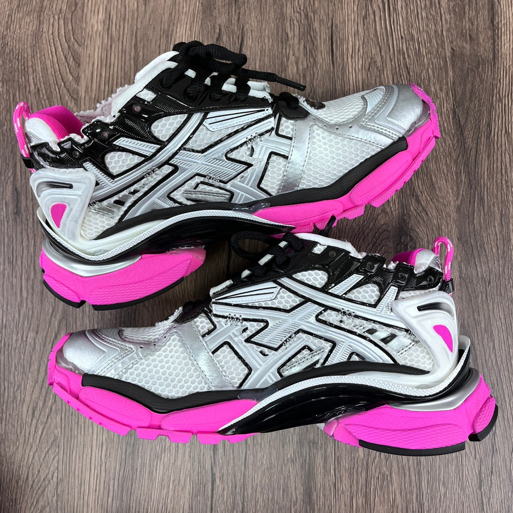Unisex Balenciaga sneakers pair, silver uppers with black accents and neon pink soles