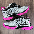 Unisex Balenciaga sneakers pair, silver uppers with black accents and neon pink soles