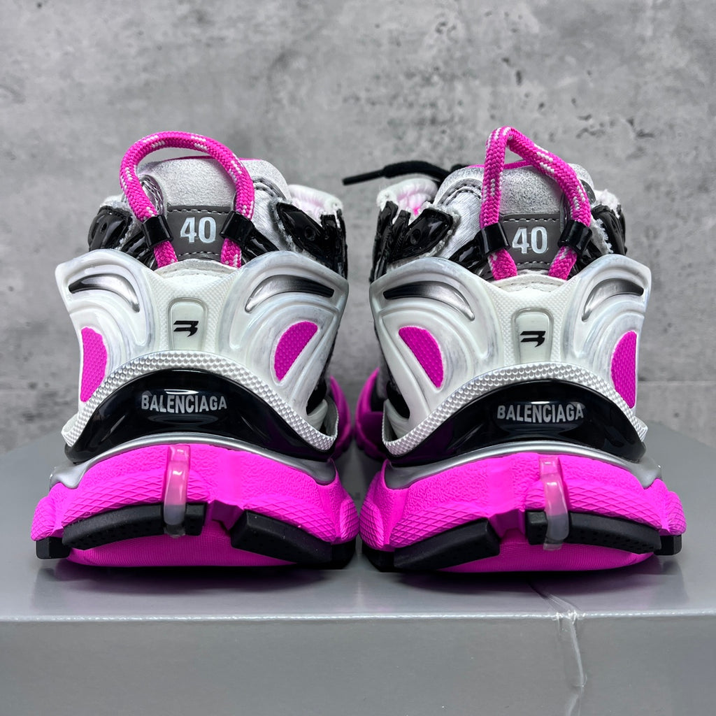 Unisex Balenciaga sneakers rear view, black straps with neon pink midsoles