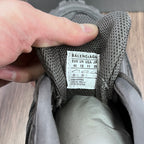 Balenciaga size label on gray sneaker tongue with EU/UK/JP sizing and 44