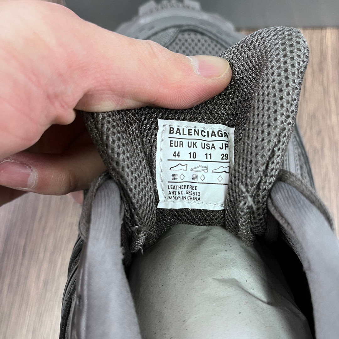 Balenciaga size label on gray sneaker tongue with EU/UK/JP sizing and 44