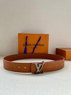 Tan monogram leather belt with silver buckle and central LV logo