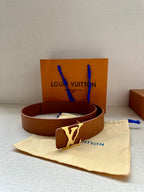 Tan monogram leather belt, silver buckle, with dust bag and Louis Vuitton box