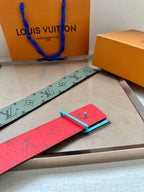 Louis Vuitton belt detail, green monogram strap with silver LV buckle and red lining