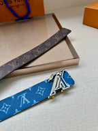 Louis Vuitton belt with blue monogram strap and silver LV buckle, side view