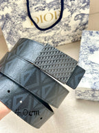 Dior belt close-up: monogram-patterned dark strap with rectangular buckle panel