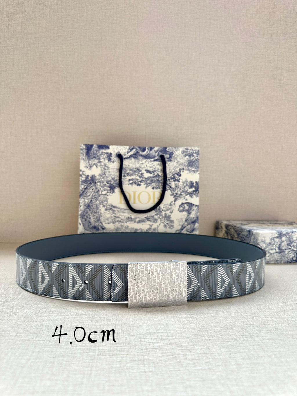 Dior belt with blue leather strap and gray jacquard logo band, buckle not shown