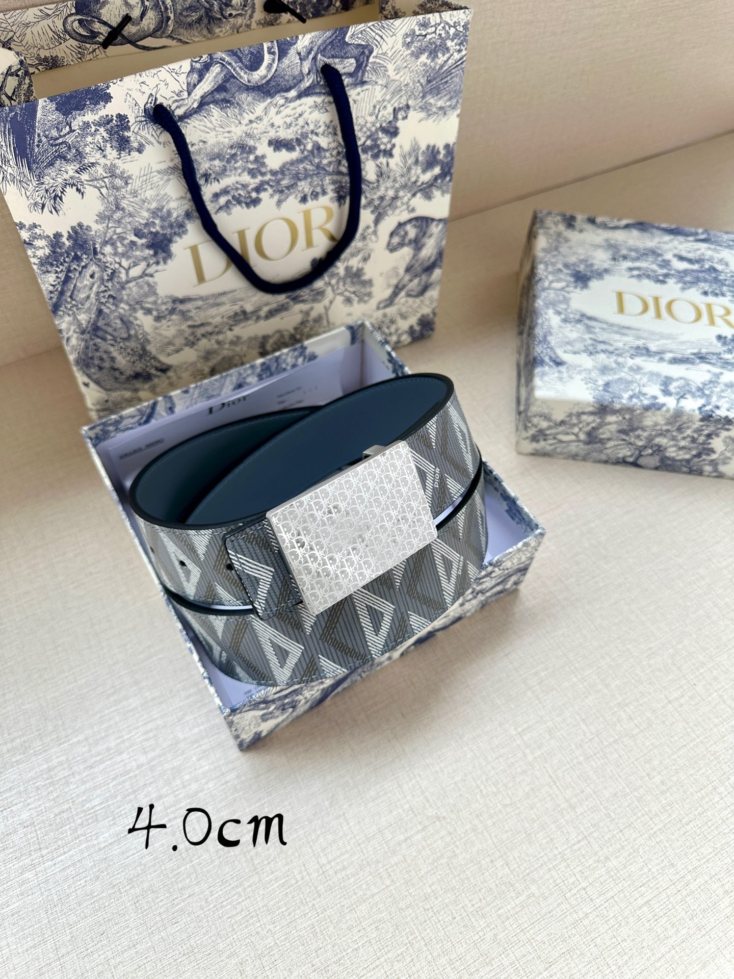 Dior belt with blue leather strap and gray jacquard logo band with silver-tone buckle