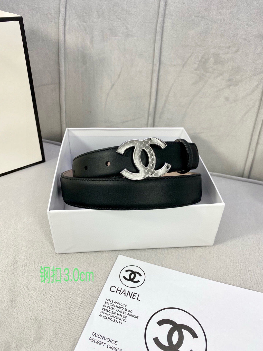 Black leather belt in box with silver-tone interlocking CC buckle