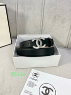 Black leather belt in box with silver-tone interlocking CC buckle