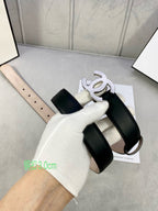 Black leather belt with silver-tone CC buckle and adjustable strap holes