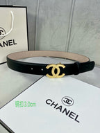Black leather belt with gold-tone CC buckle laid across box insert