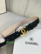 Black leather belt with gold-tone CC logo buckle and tan inner strap