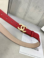 Chanel belt, red leather strap with gold-tone double C buckle and punched holes.