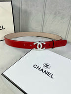 Chanel belt in red leather with silver-tone double C buckle on straight strap.
