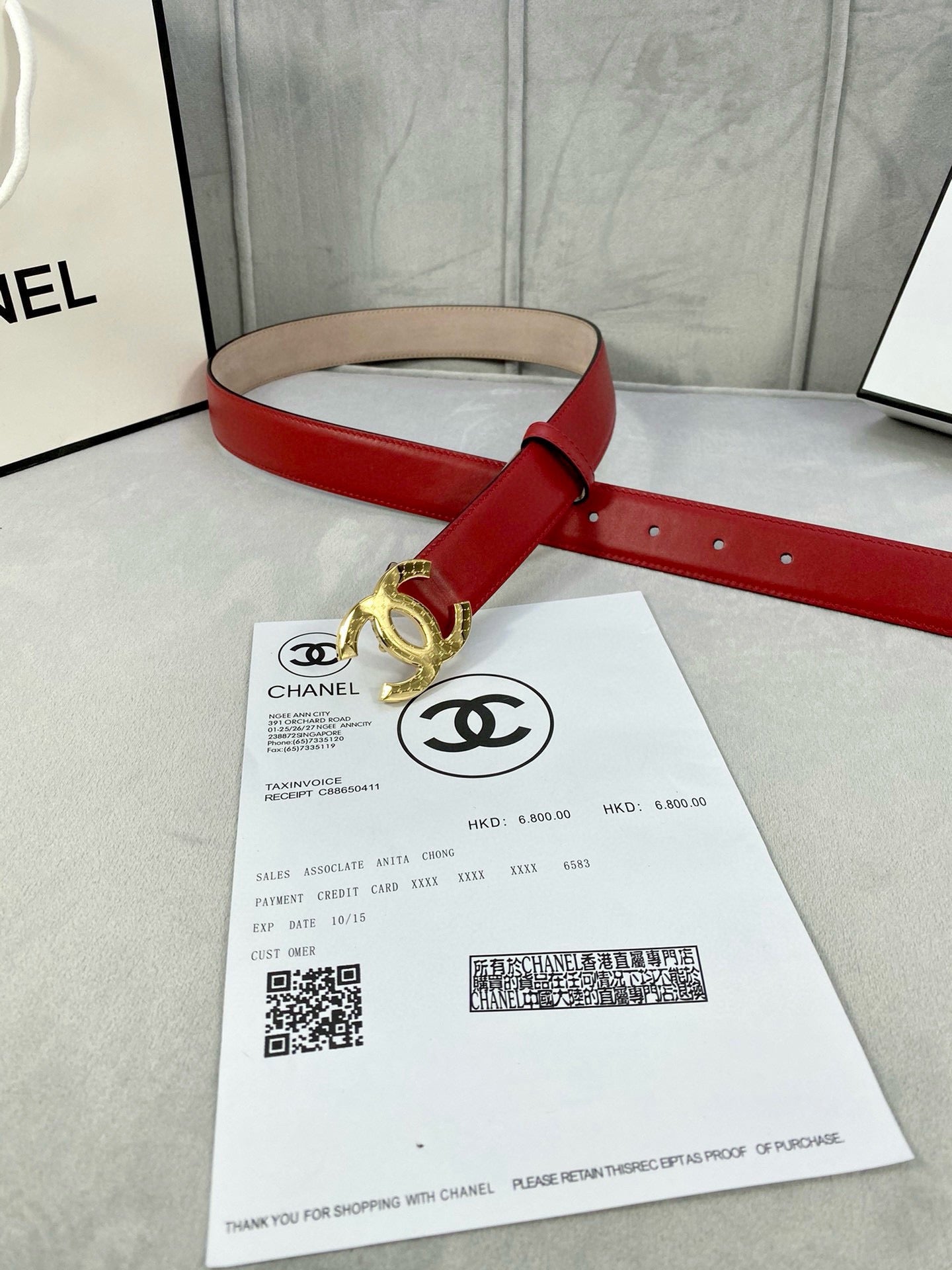 Chanel belt red leather with gold-tone double C buckle and adjustable strap holes.