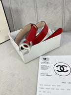 Chanel belt red leather with silver-tone double C buckle on metal hardware.