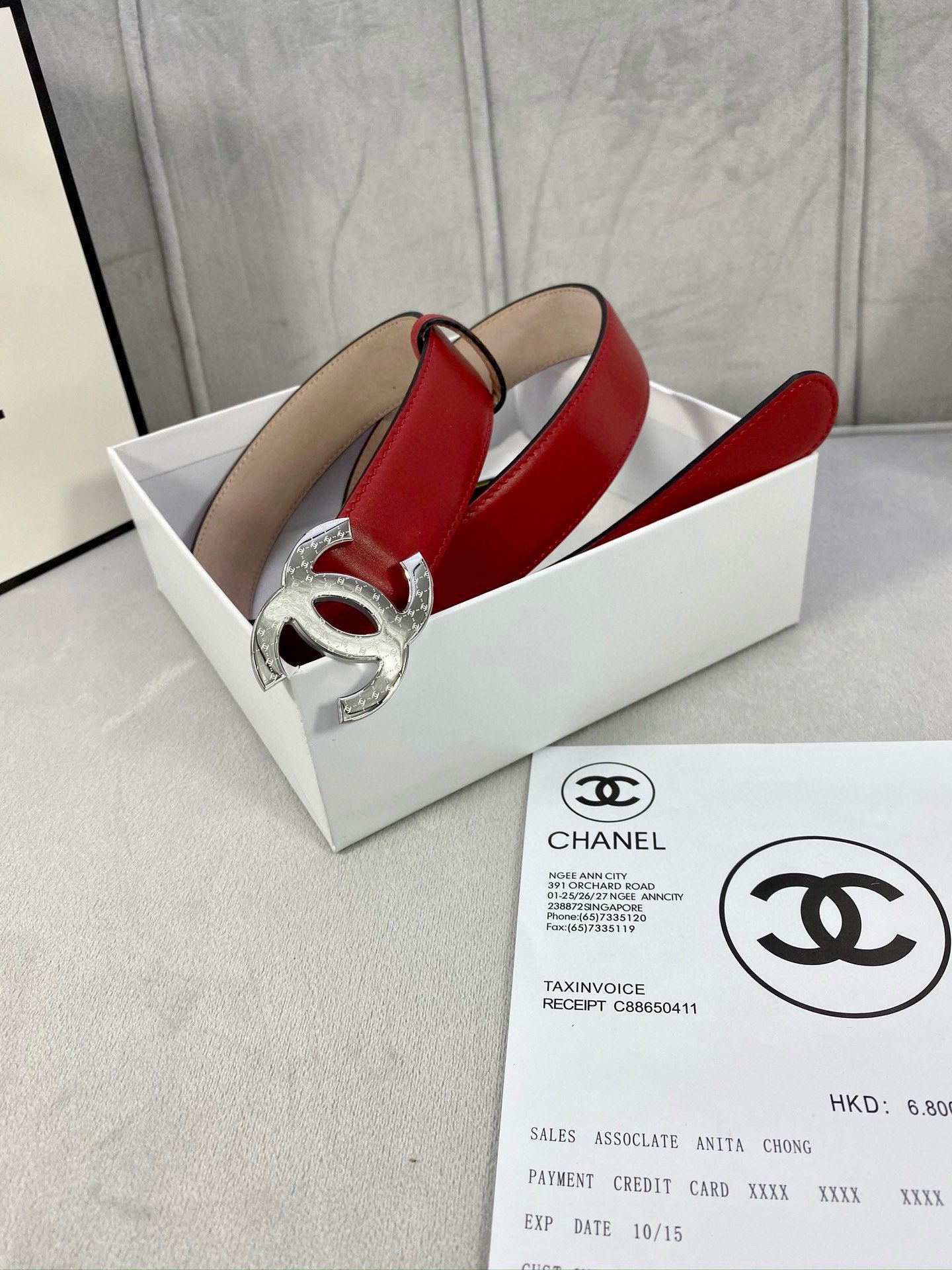 Chanel belt red leather with silver-tone double C buckle on metal hardware.