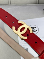 Chanel belt close-up: red leather with gold-tone double C buckle center.