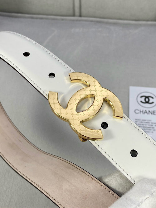 White belt strap with gold-tone CC buckle detail and round punched holes